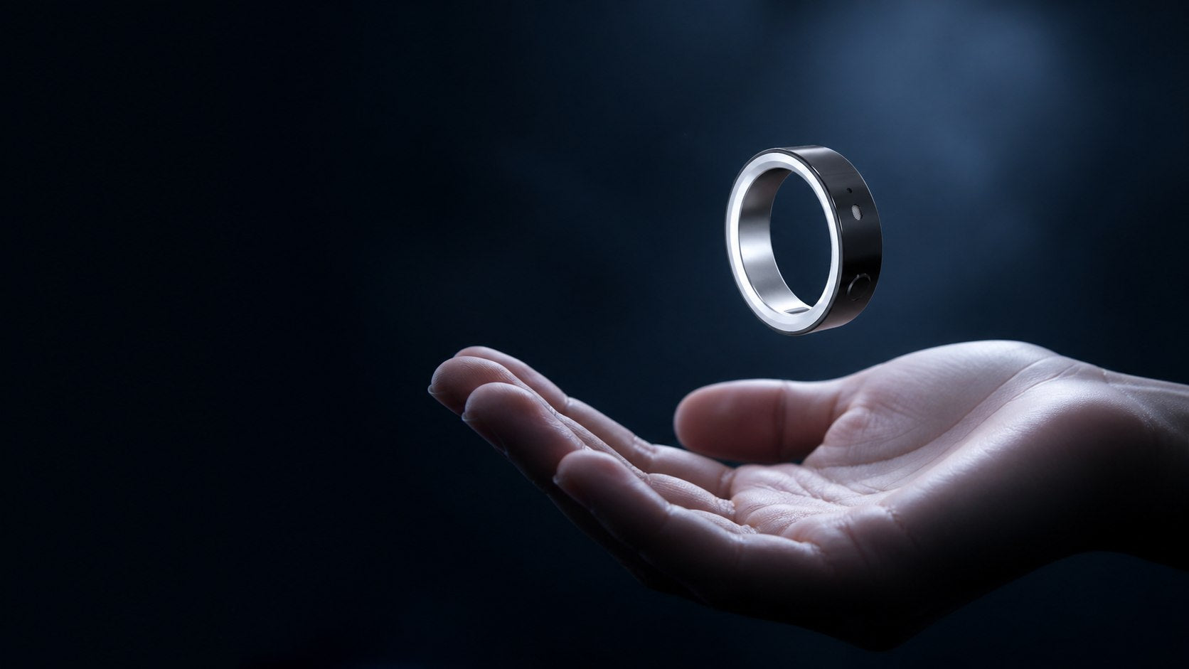 A hand presenting the AWAAKII ring